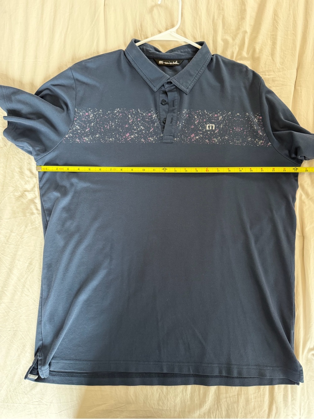 Travis Mathew Navy Polo with Subtle Speckle Stripe